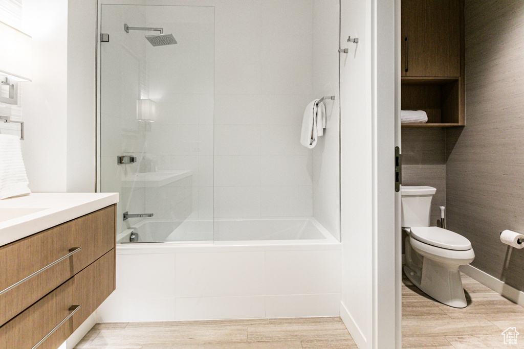 Full bathroom featuring vanity, toilet, and tiled shower / bath