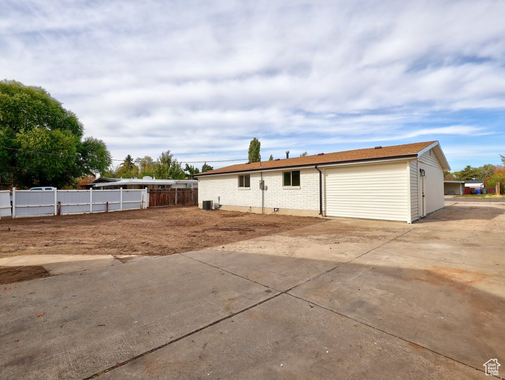 Exterior space featuring a garage and central AC unit