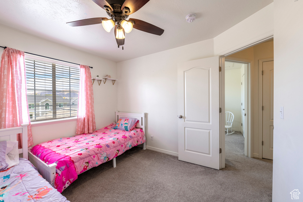 Bedroom featuring carpet flooring and ceiling fan