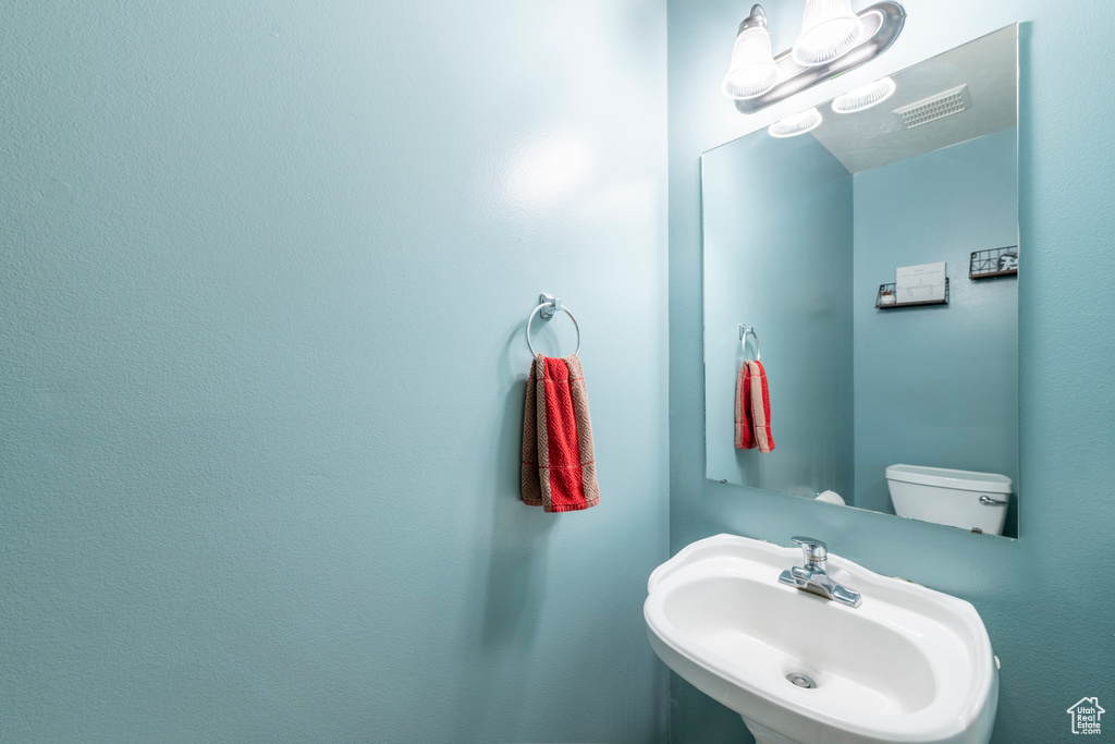 Bathroom with sink and toilet