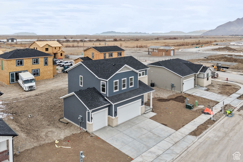 Aerial view of residential area with a mountainous background