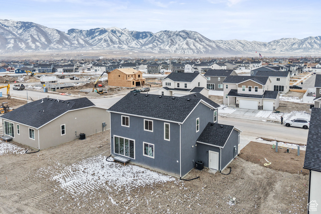 Aerial perspective of suburban area with a mountain backdrop