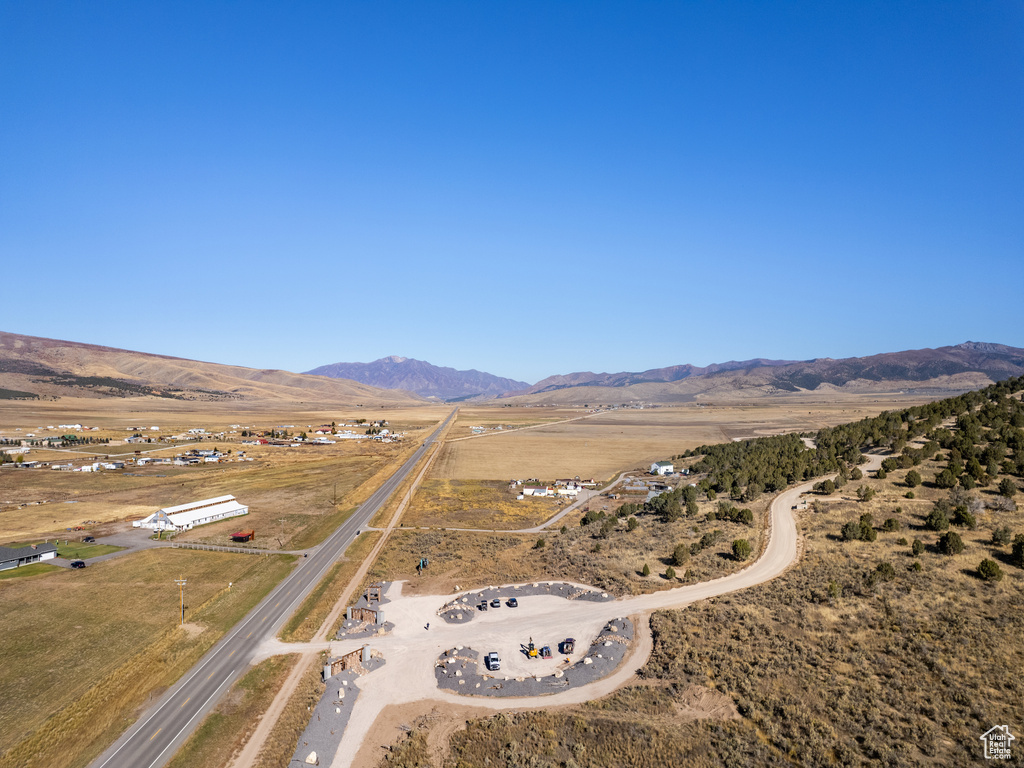 Drone / aerial view with a mountain view and a rural view