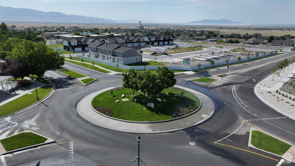 Aerial perspective of suburban area featuring a mountainous background