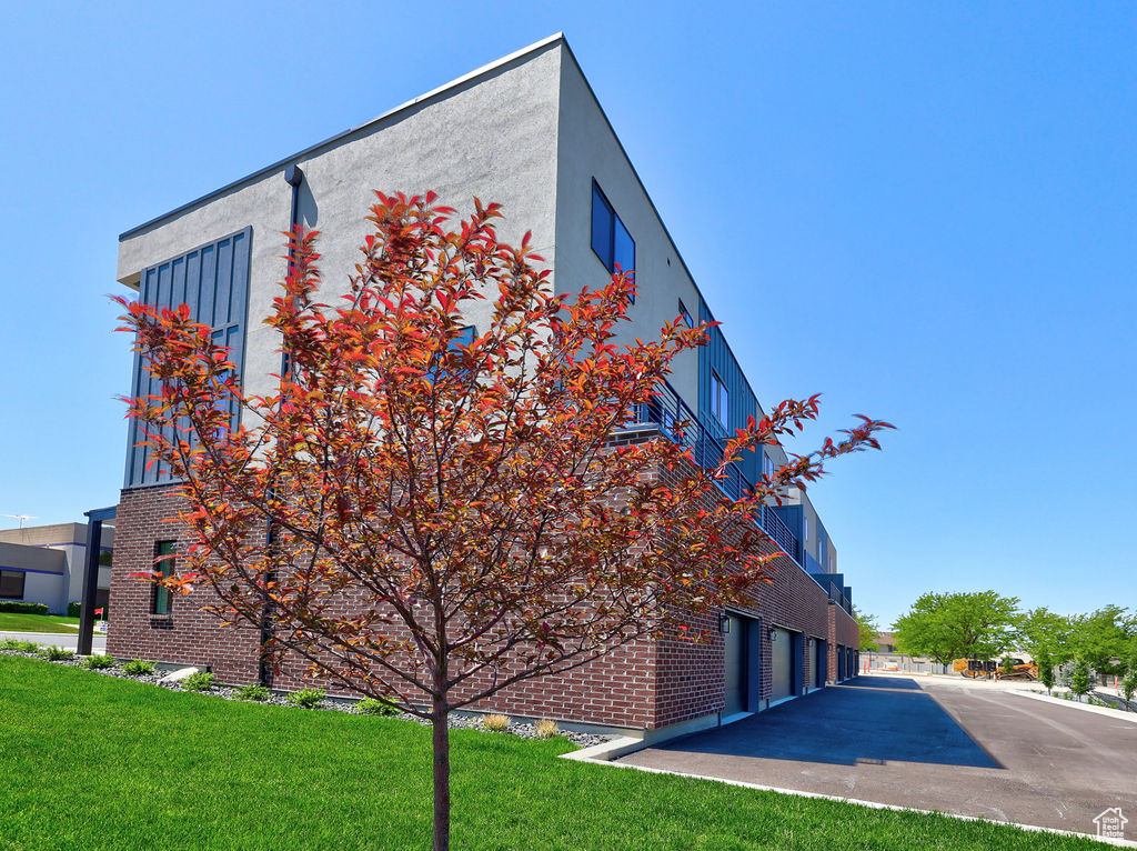 View of building exterior featuring a garage
