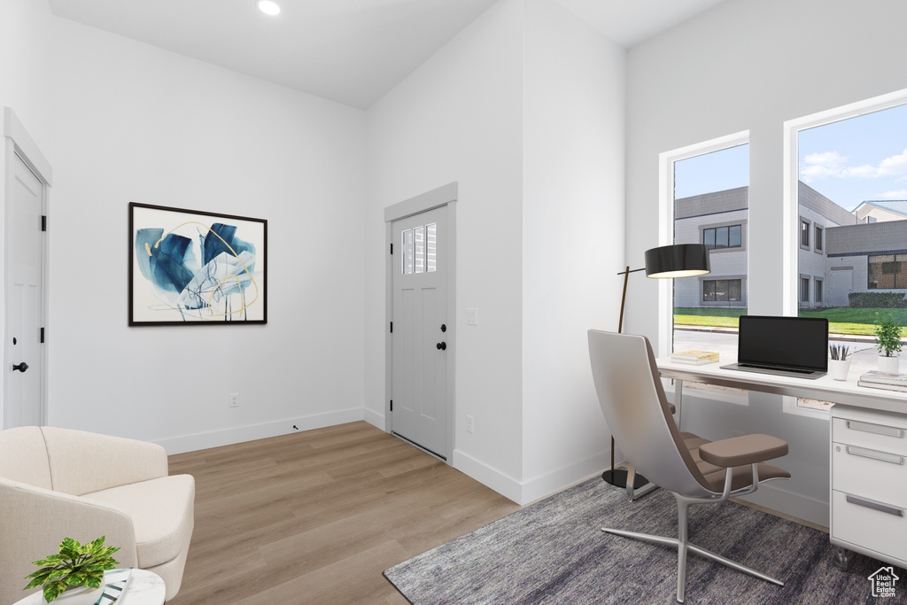 Home office featuring wood finished floors, baseboards, and recessed lighting