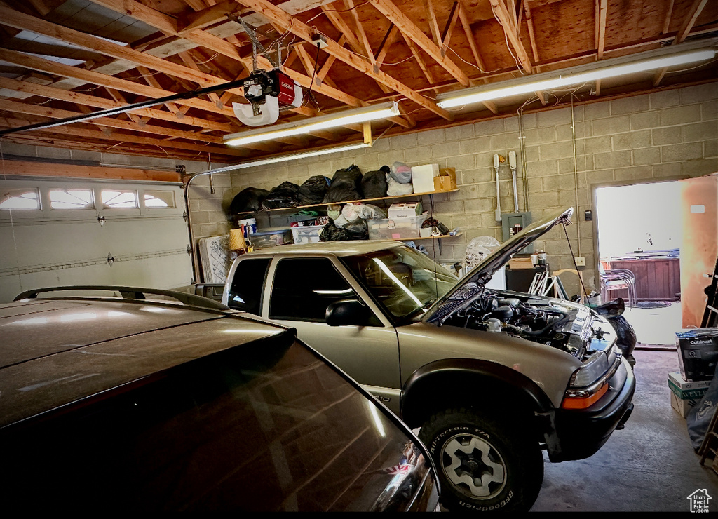 Garage featuring a garage door opener