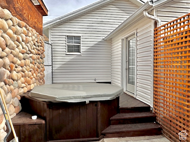 Wooden deck featuring a hot tub