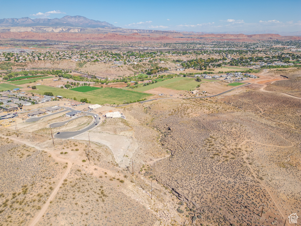 Birds eye view of property with a mountain view