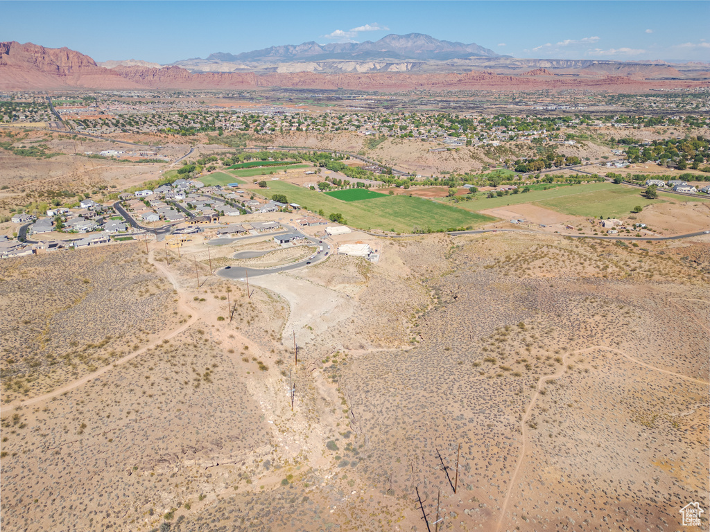 Birds eye view of property featuring a mountain view