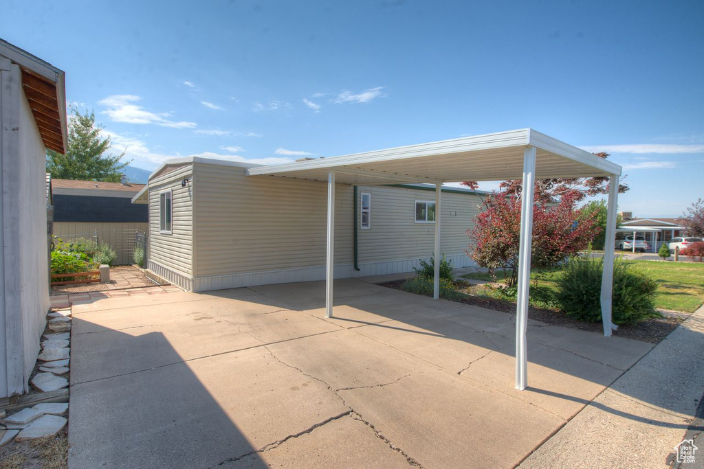View of patio / terrace featuring a carport