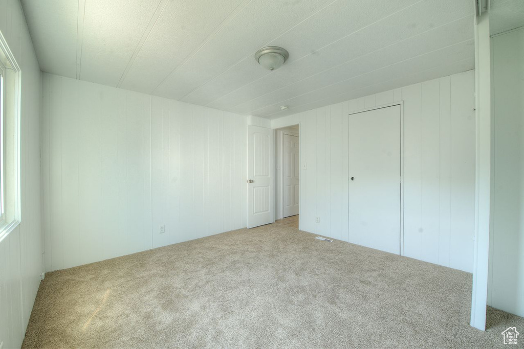 Unfurnished bedroom featuring carpet
