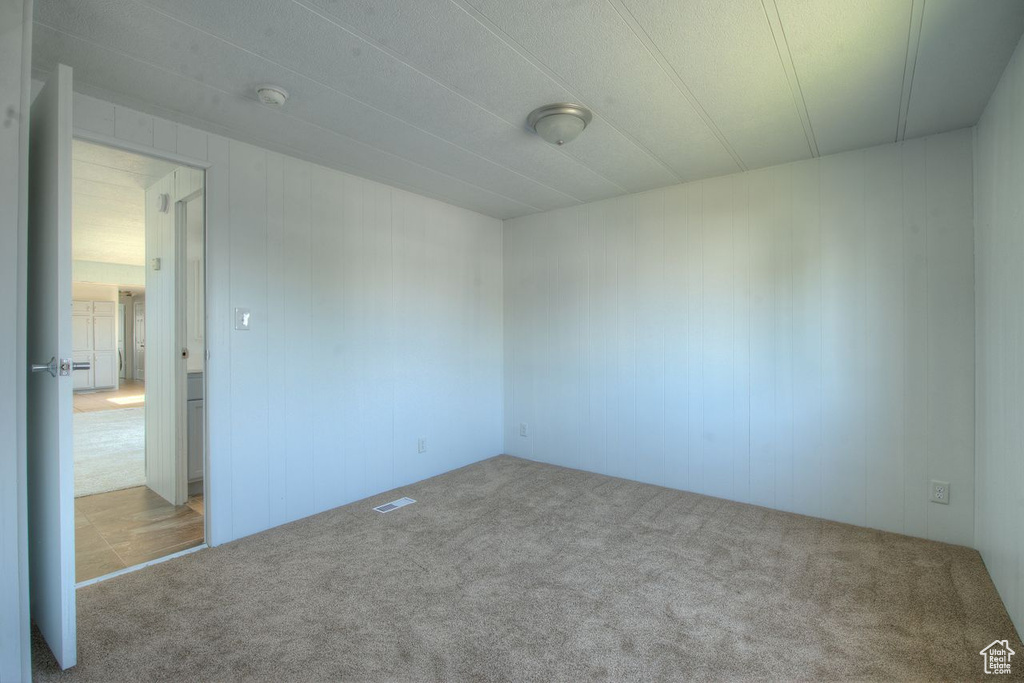 Spare room with carpet floors