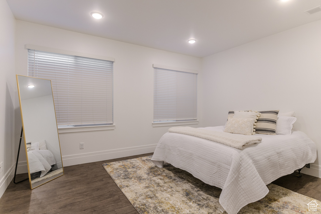 Bedroom featuring dark wood-type flooring