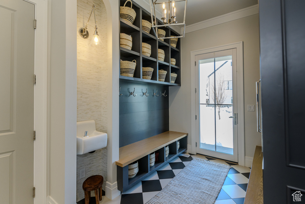 Mudroom featuring ornamental molding