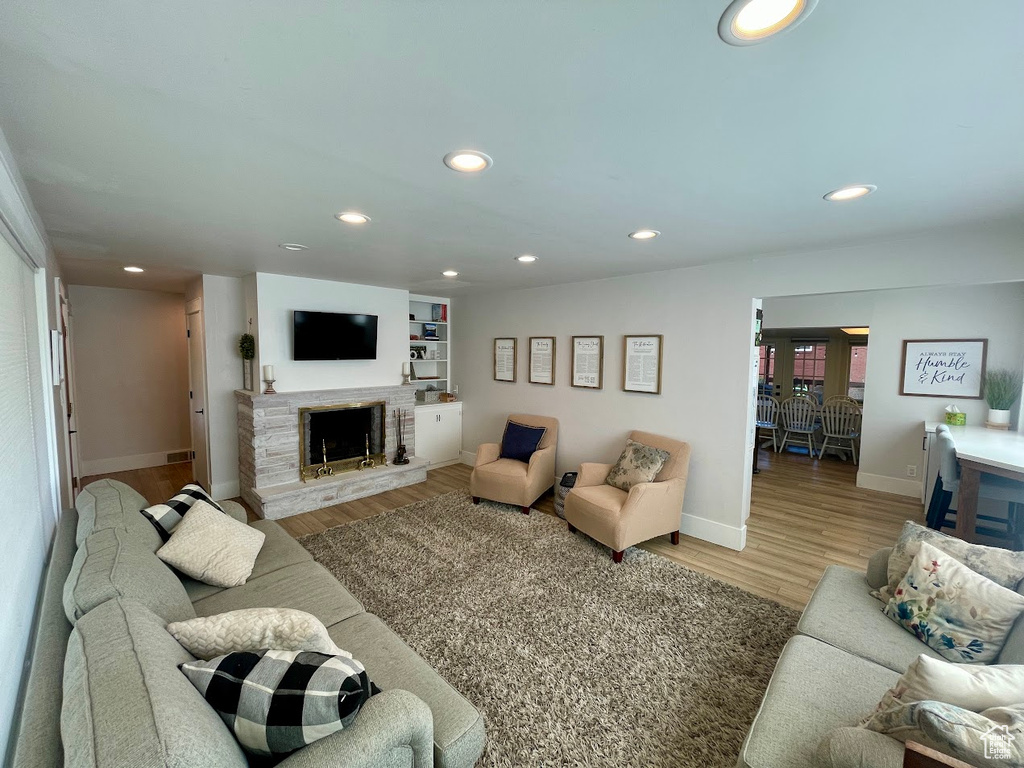 Living room featuring hardwood / wood-style floors and a fireplace