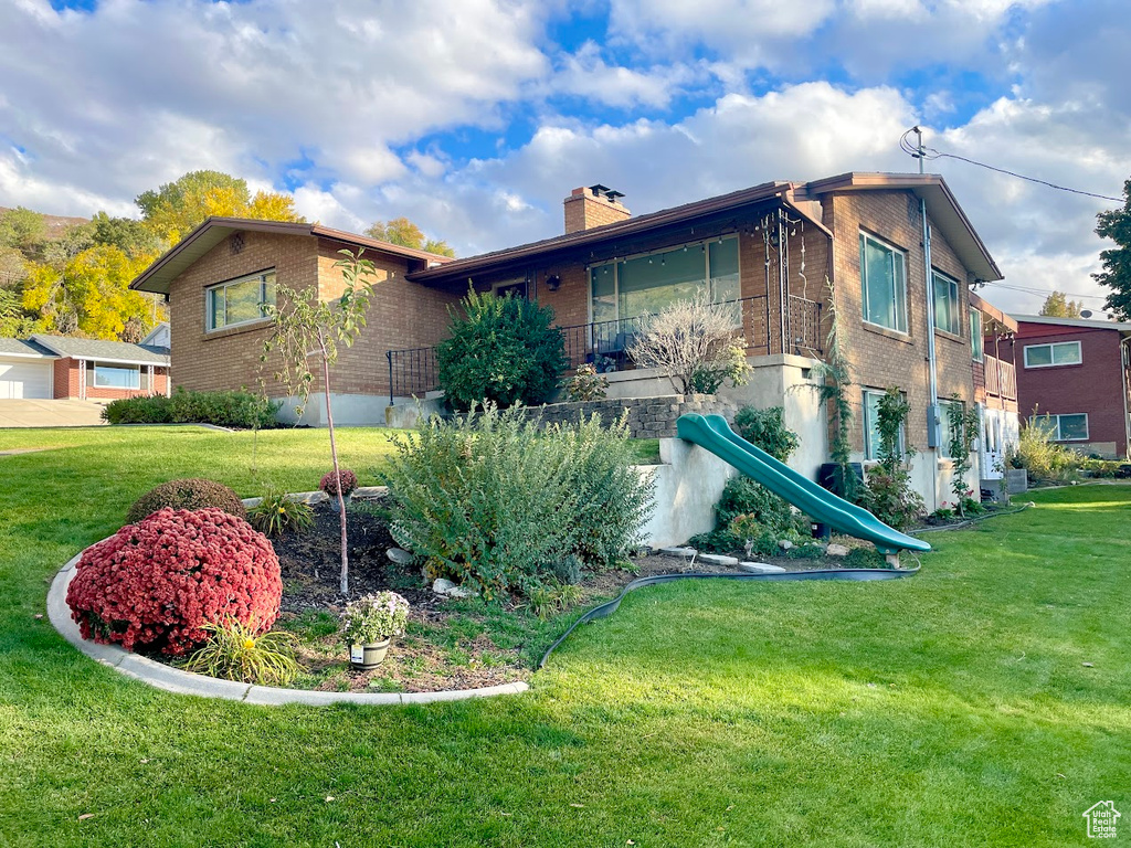 View of front of property with a front yard