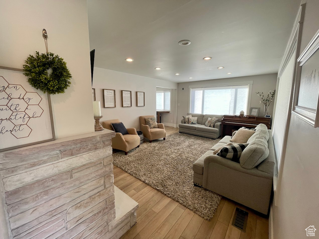 Living room with light hardwood / wood-style flooring