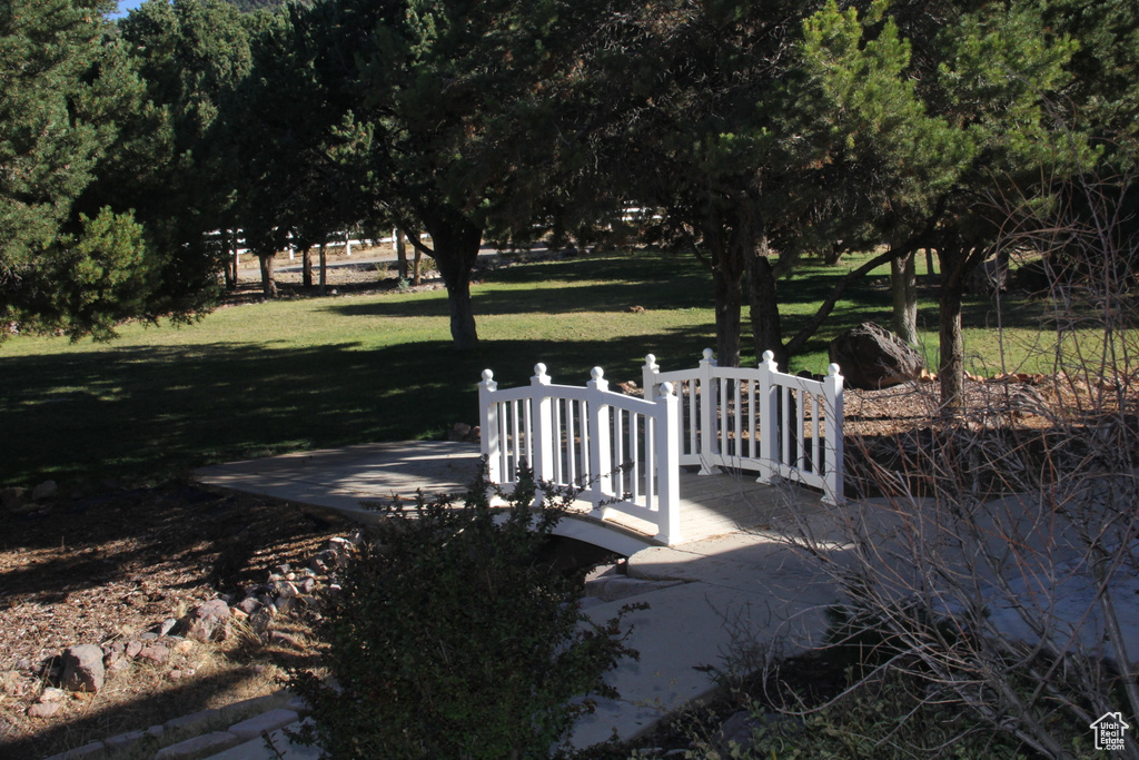 View of home's community featuring a lawn and a patio area
