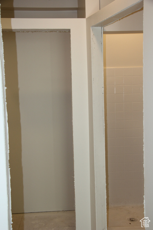 Bathroom with concrete flooring and walk in shower