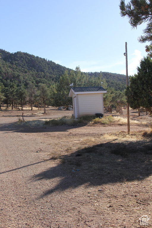 View of yard with a mountain view and a rural view