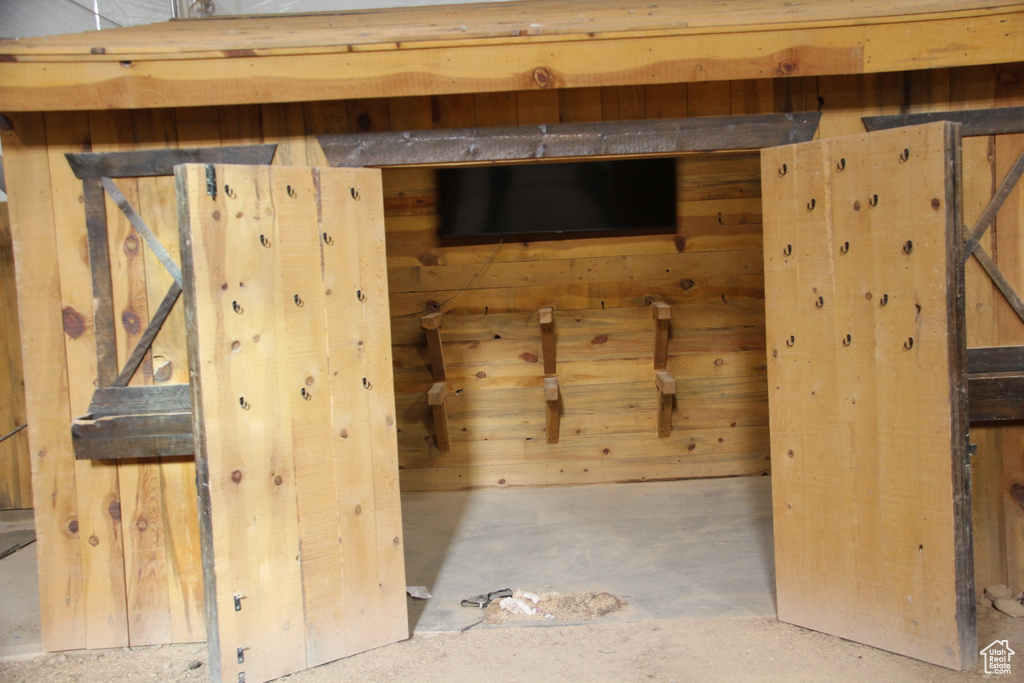 Interior space featuring wood walls