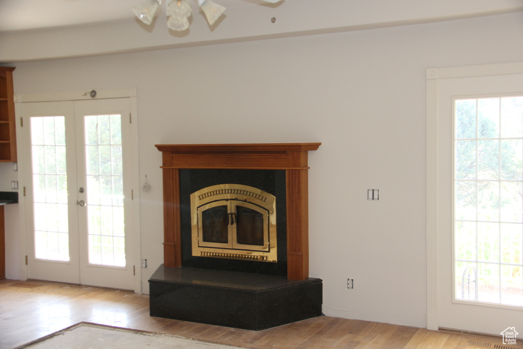 Room details with french doors, hardwood / wood-style flooring, and ceiling fan