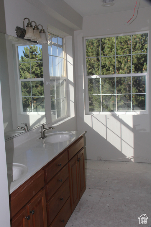 Bathroom with concrete flooring and vanity