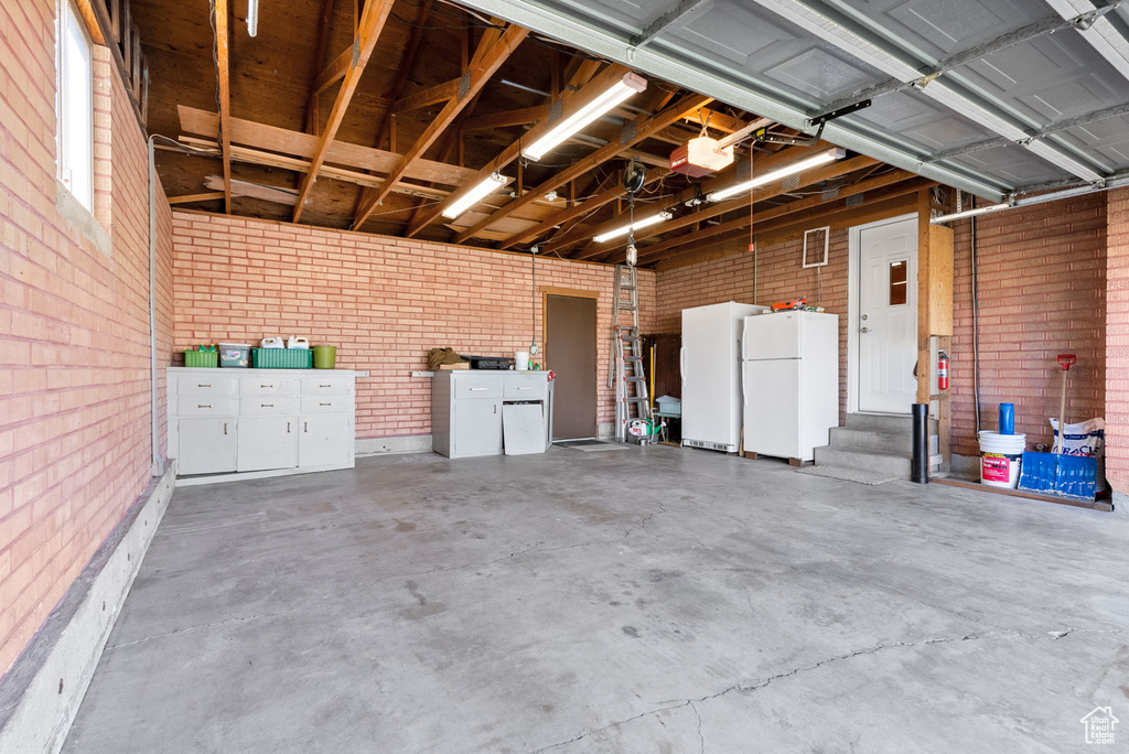 Garage with white fridge