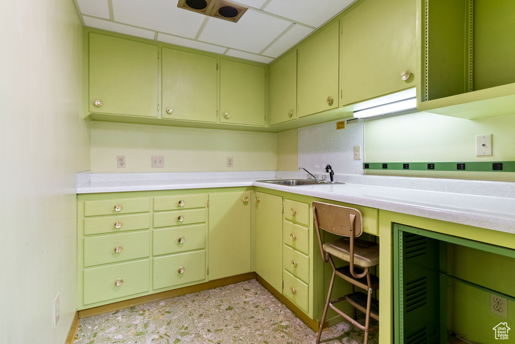 Kitchen featuring a paneled ceiling and sink