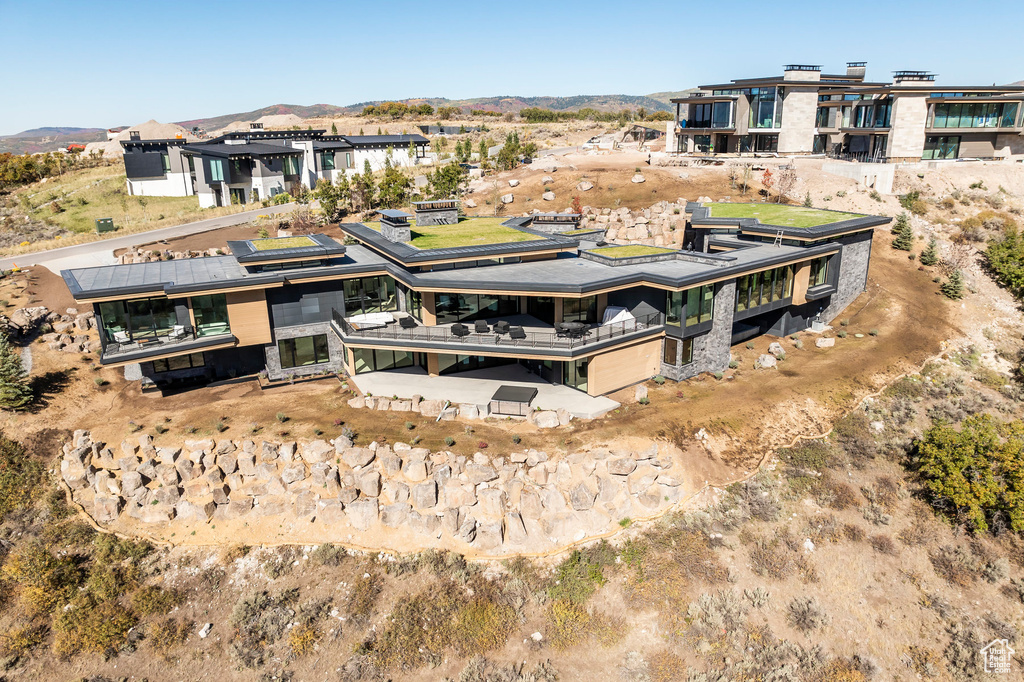 View from above of property with a mountainous background