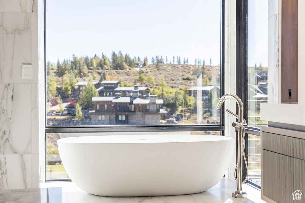 Bathroom view of a freestanding tub and a sink