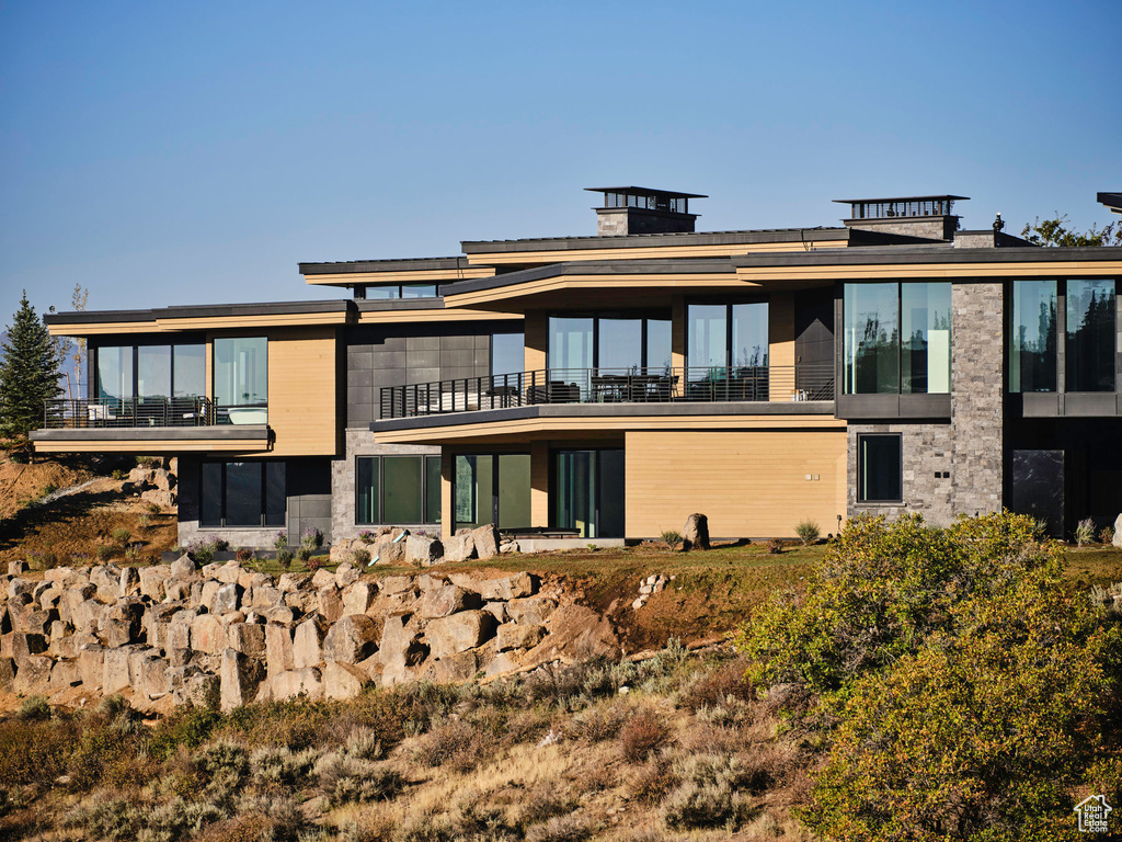 Rear view of property featuring a balcony