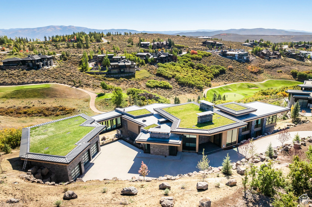 View from above of property with a mountainous background
