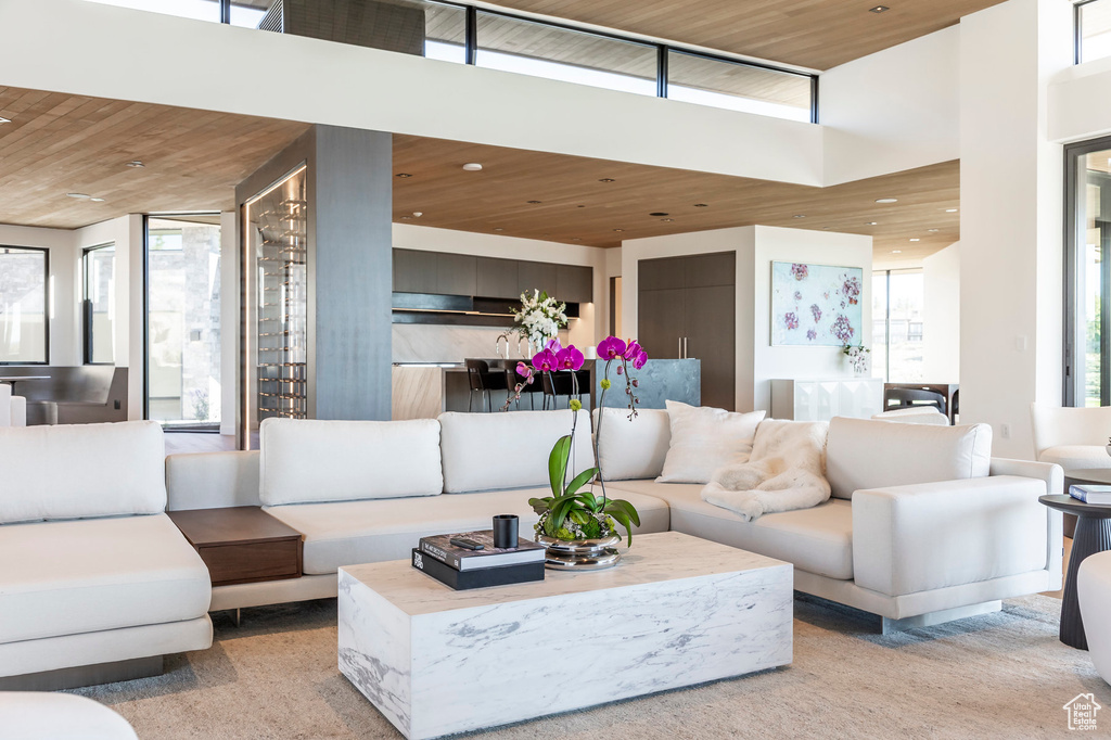 Living room featuring wood ceiling and recessed lighting
