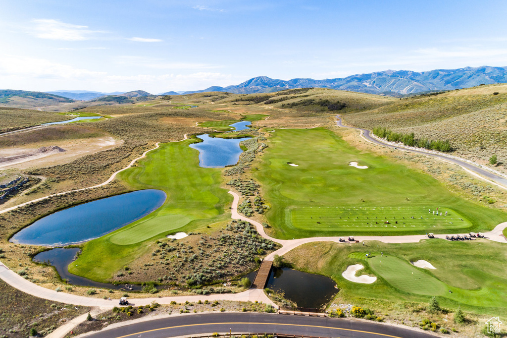 Bird's eye view of a water and mountain view and a golf course