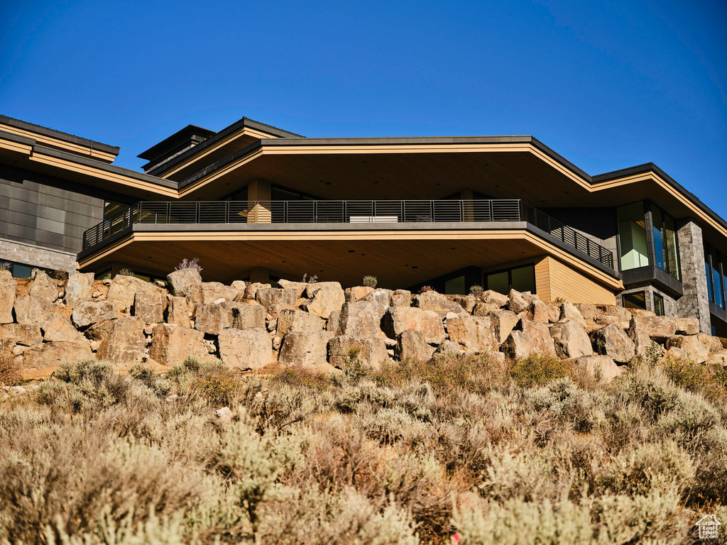 View of home's exterior with a balcony