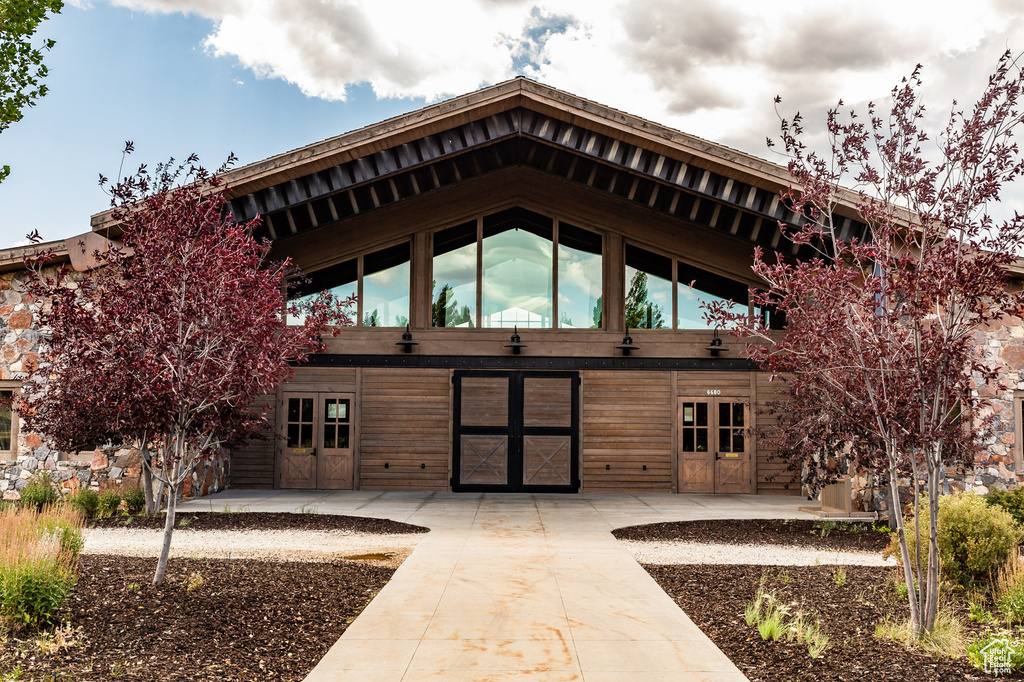 Rear view of property featuring french doors