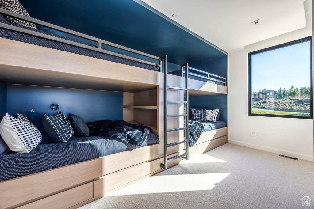 Carpeted bedroom with baseboards