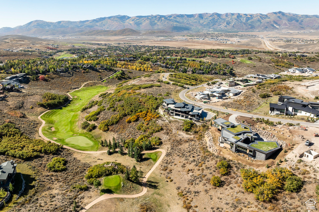 Drone / aerial view of mountains and a local golf course