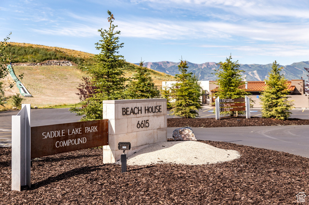Community sign featuring a mountain view