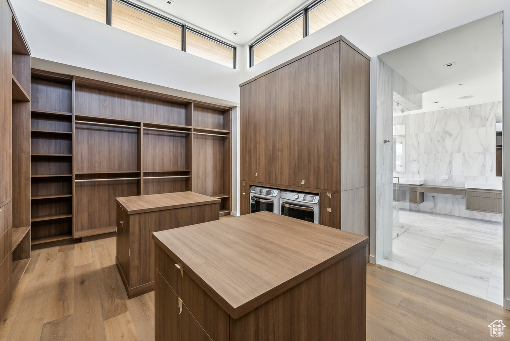 Spacious closet with light wood-style floors