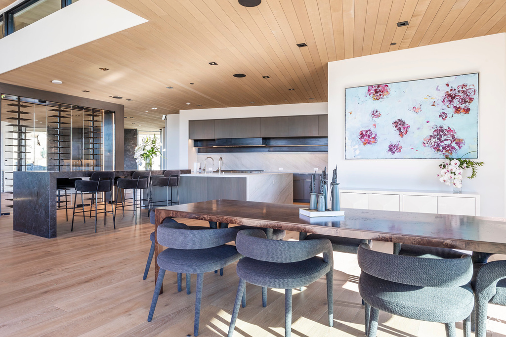 Dining room with wooden ceiling, light wood-type flooring, and recessed lighting