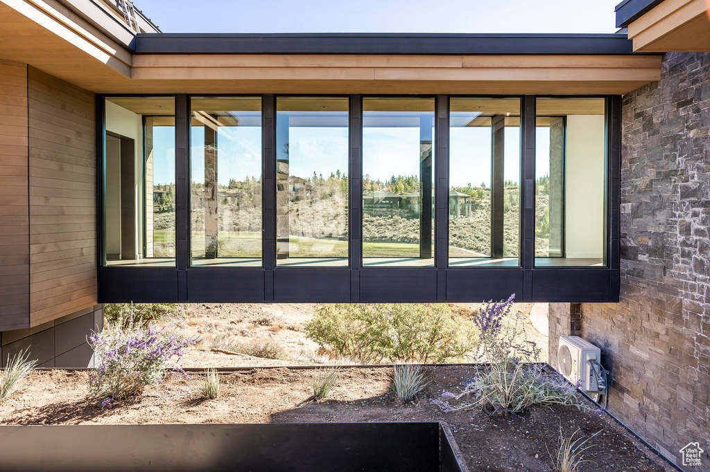 View of home's exterior with a sunroom