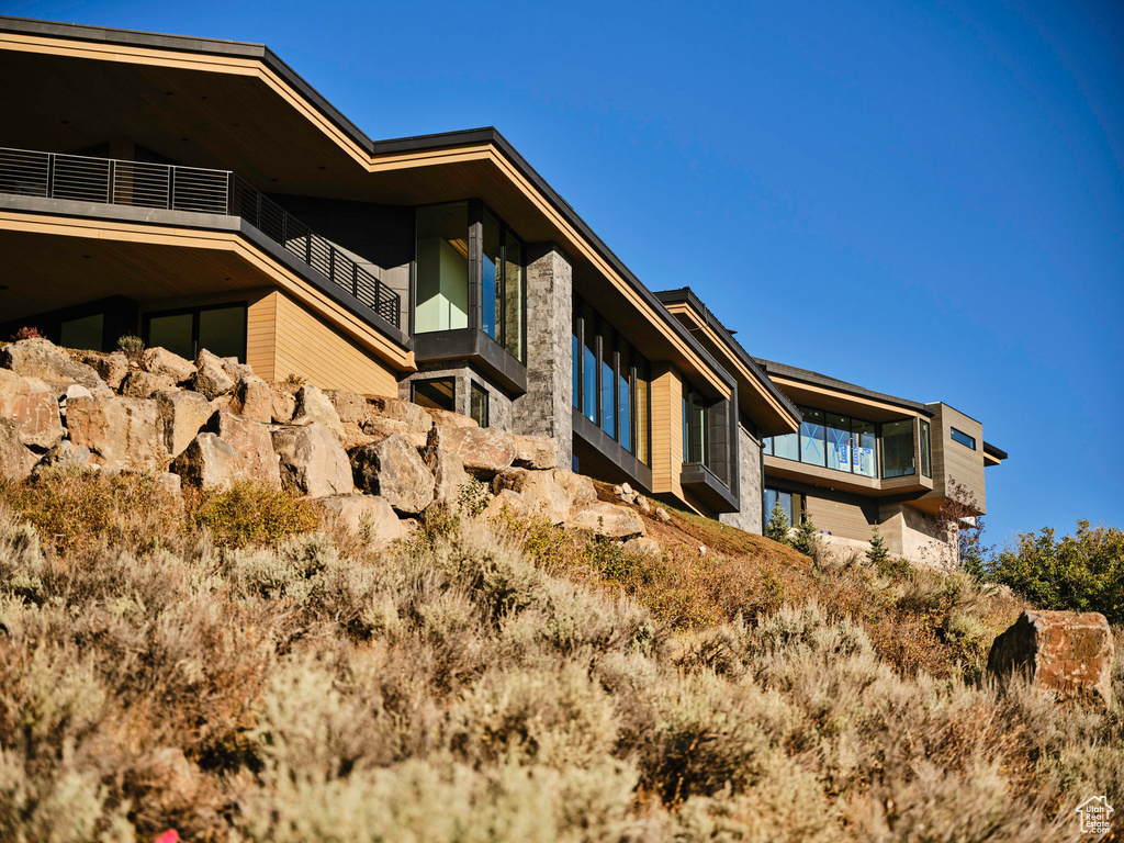 View of home's exterior with a balcony
