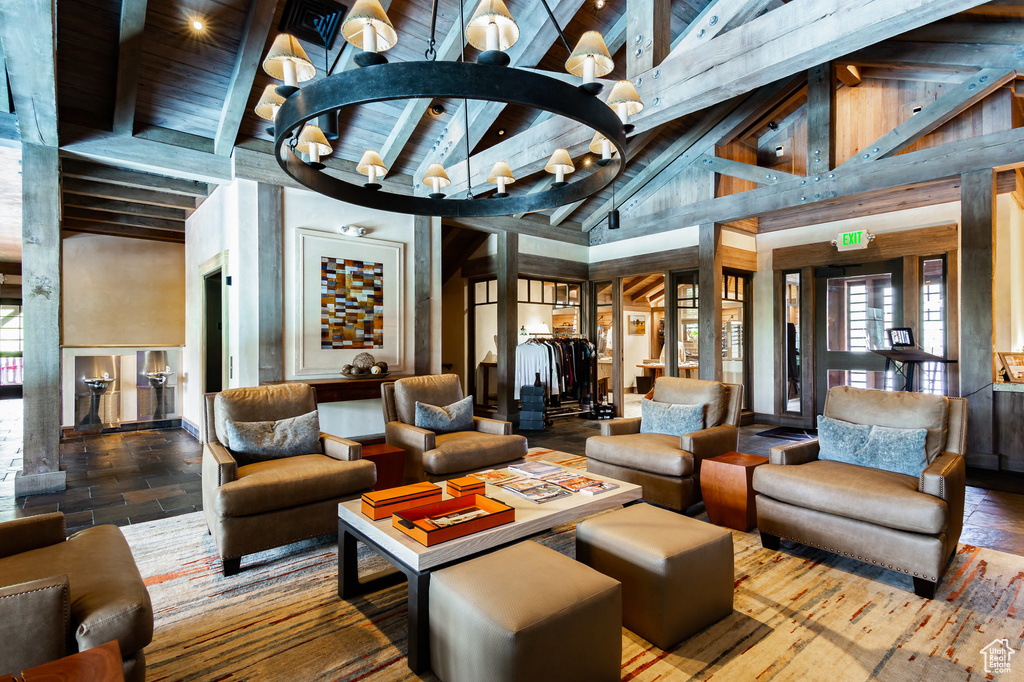 Building lobby featuring beam ceiling, high vaulted ceiling, and wood ceiling