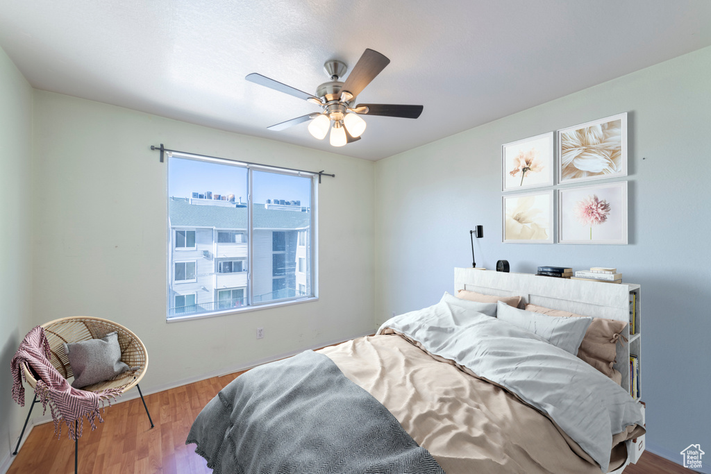 Bedroom featuring wood-type flooring and ceiling fan