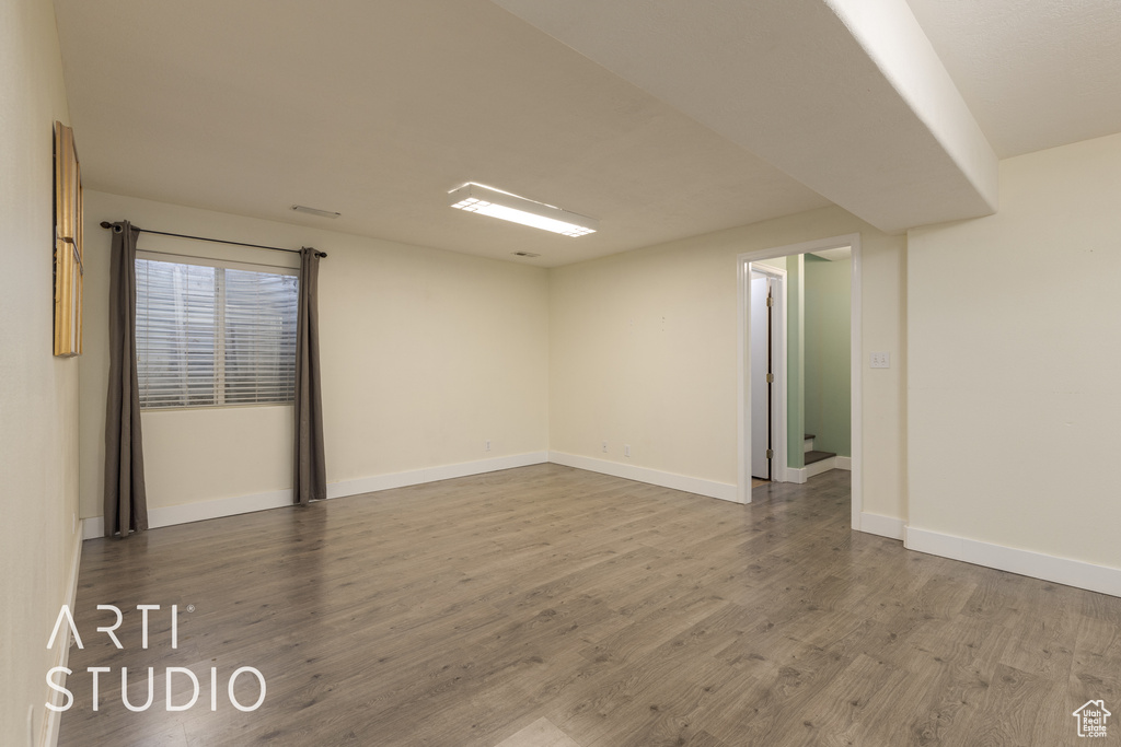 Unfurnished room with wood-type flooring