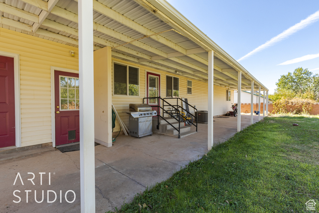 View of patio featuring central AC unit and a grill