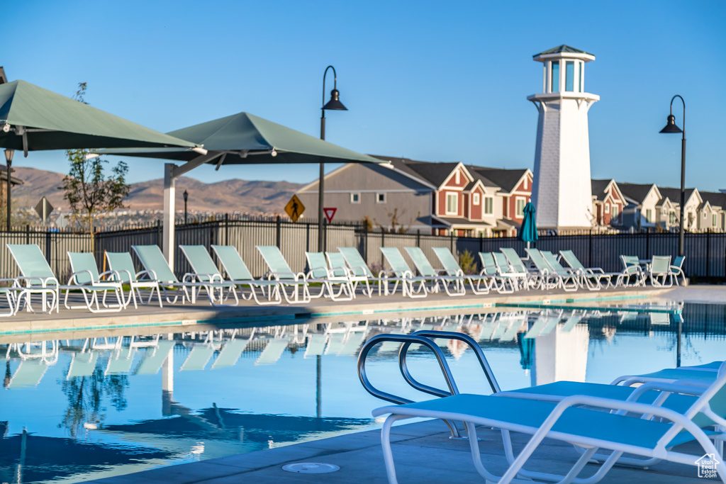 View of swimming pool with a mountain view
